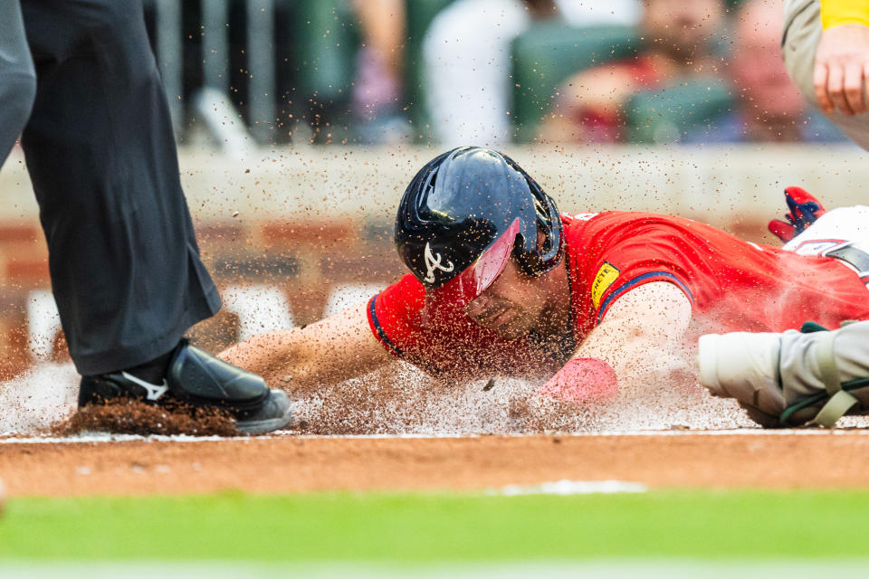 ATLANTA, GA - MAY 31: Austin Riley #27 of the Atlanta Braves slides into home scoring a run in the first inning against the Oakland Athletics at Truist Park on May 31, 2024 in Atlanta, Georgia. (Photo by Matthew Grimes Jr./Atlanta Braves/Getty Images)