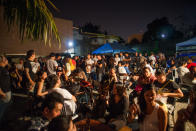 People spilled over to the parking lot to hang out because it was packed inside the venue. Photo by Niña Sandejas.