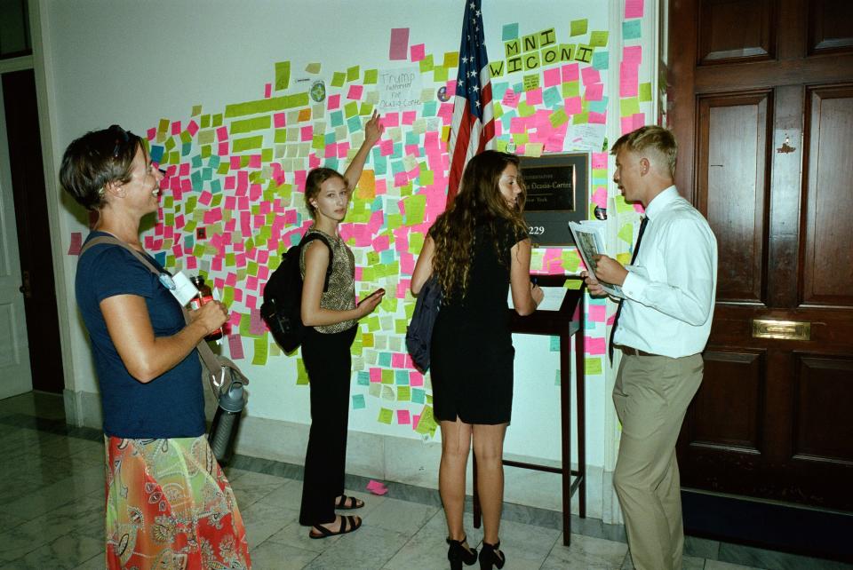 Visitors are constantly outside of her office, hoping to catch a glimpse of the congresswoman. They also leave messages on Post-It notes.