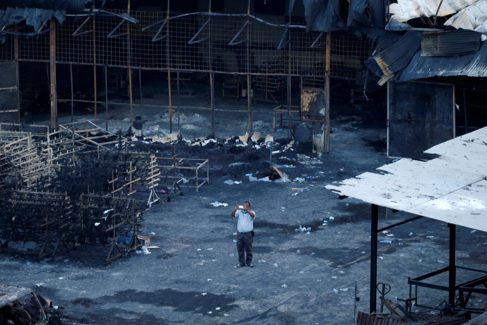 <p>A plainclothes police officer works at the site of an explosion at a fireworks factory at Kosambi village in Tangerang, Indonesia Banten province, Oct. 26, 2017. (Photo: Beawiharta/Reuters) </p>