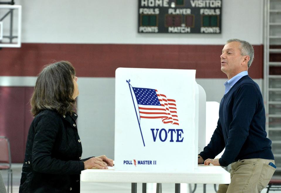 Melissa Pastore, at left, and Dan Pastore talk over the voting privacy dividers, on Nov. 8, 2022, at the Fairview Township, Erie County 4th district polling place at Weis Library United Methodist Church at the eastern edge of the township. In Tuesday's midterm election, Dan Pastore is the Democratic nominee in the 16th Dist. U.S. House race against incumbent U.S. Rep. Mike Kelly, of Butler, R-16th Dist.