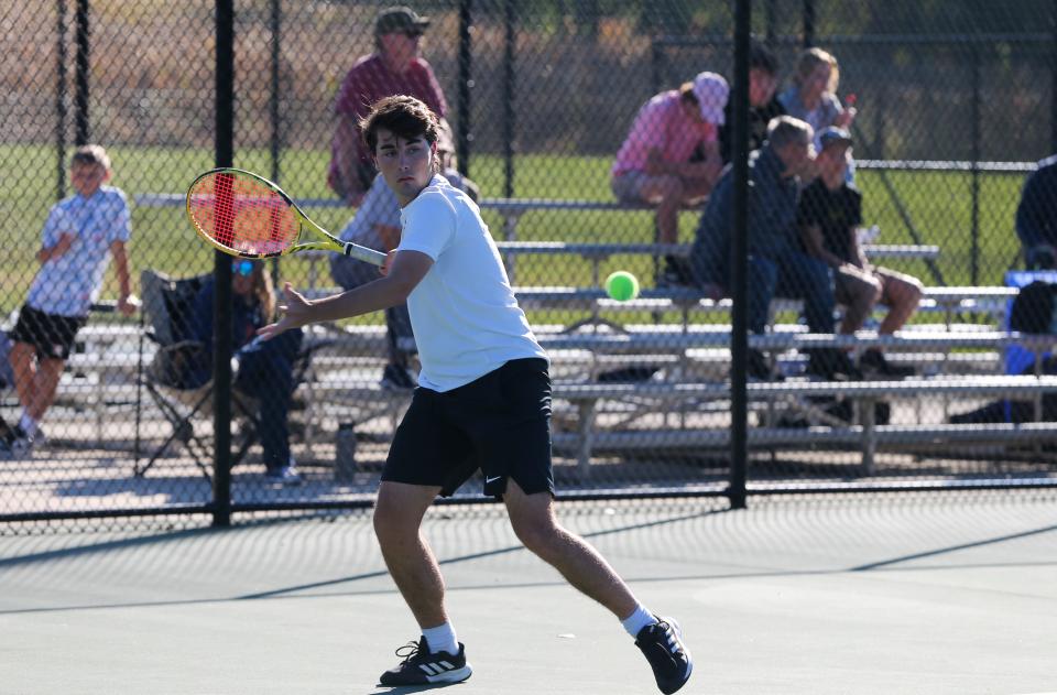 Harrison’s Isaac Flanery prepares to hit the ball during the IHSAA boys’ tennis Sectional against Lafayette Jefferson, Friday, Sept. 30, 2022, at Harrison High School, in West Lafayette, Ind.