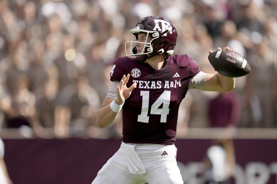 Texas A&M quarterback Max Johnson (14) looks to pass down field against South Carolina during the first quarter of an NCAA college football game Saturday, Oct. 28, 2023, in College Station, Texas. (AP Photo/Sam Craft)