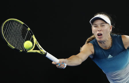 Tennis - Australian Open - Third Round - Melbourne Park, Melbourne, Australia, January 18, 2019. Denmark's Caroline Wozniacki in action during the match against Russia's Maria Sharapova. REUTERS/Aly Song