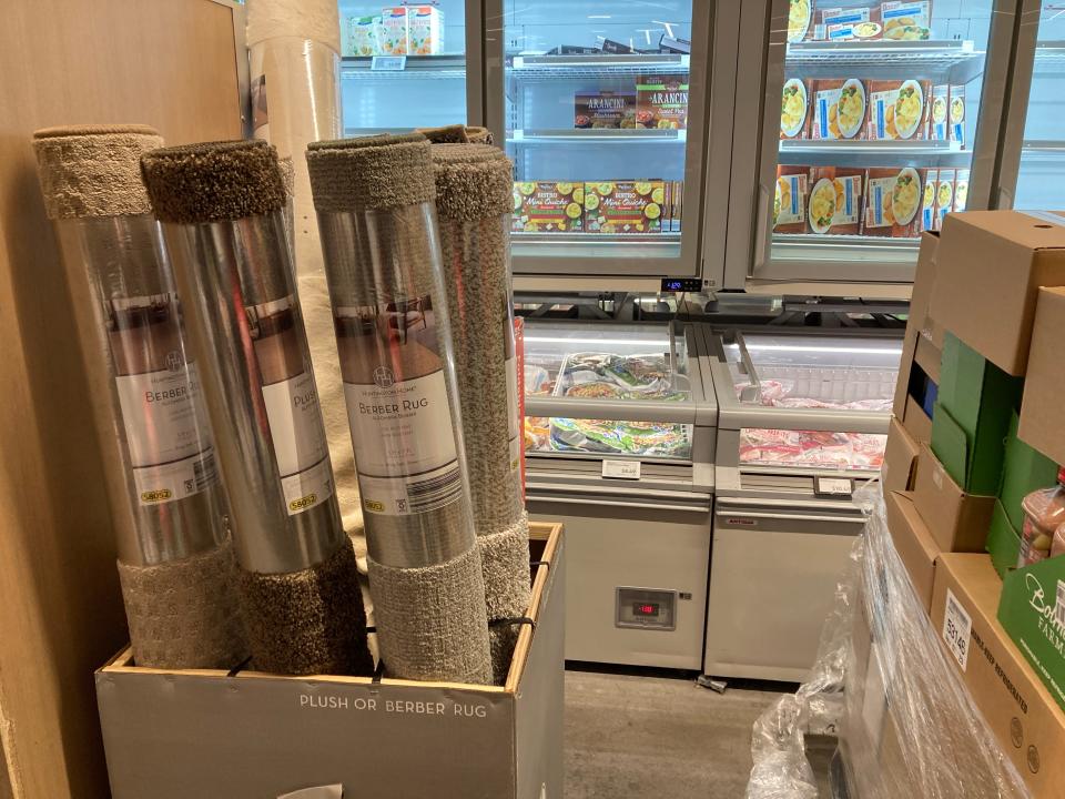 Rugs next to frozen items at Aldi in New York City