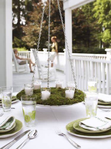 <p>This alfresco chandelier comes together easier than it looks, but the suspended candles (or flowers!) will make an instant impression.</p><p><em><a href="https://www.goodhousekeeping.com/home/gardening/advice/g1317/plant-arrangements/?slide=4" rel="nofollow noopener" target="_blank" data-ylk="slk:Get the tutorial »;elm:context_link;itc:0;sec:content-canvas" class="link ">Get the tutorial »</a></em> </p>