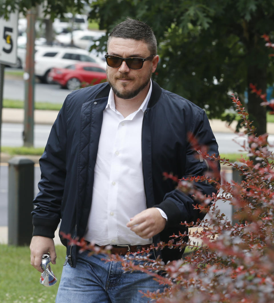 White Nationalist Jason Kessler arrives at Federal court 45 minutes late for a hearing on his rally permit in Charlottesville, Va., Tuesday, July 24, 2018. Kessler, an organizer of last summer's deadly white nationalist rally in Virginia, has withdrawn his request for a court order allowing him to stage an event marking the rally's anniversary. (AP Photo/Steve Helber)