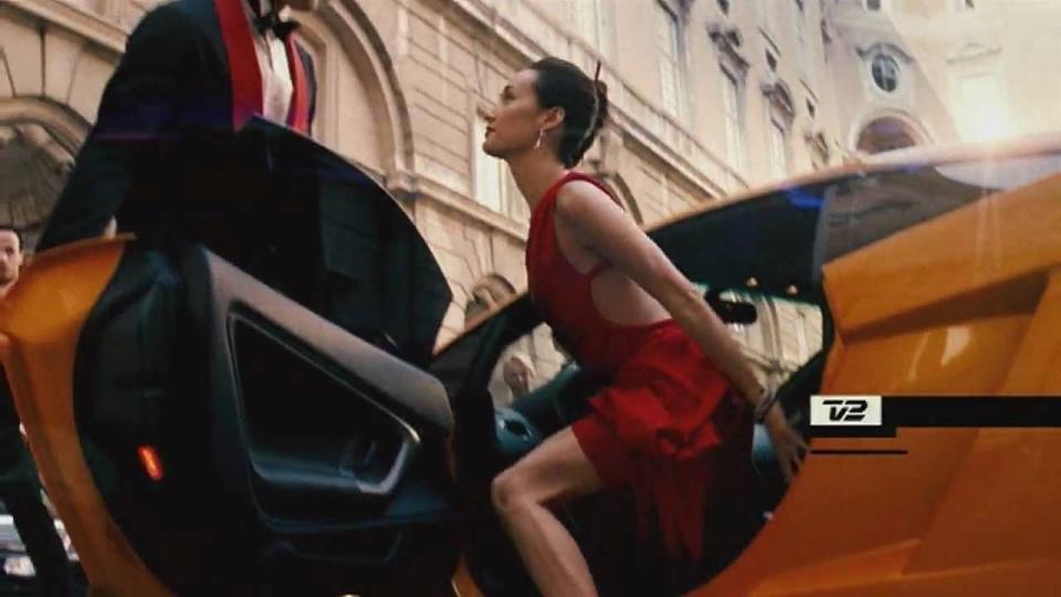 zhen lei exits a hot car in a hotter dress in a scene from mission impossible 3 it is the third film if you're watching the mission impossible movies in order