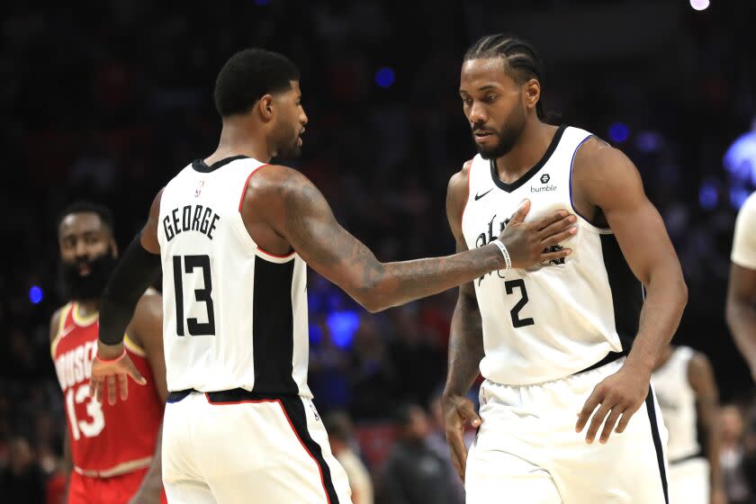 LOS ANGELES, CALIFORNIA - NOVEMBER 22: Kawhi Leonard #2 is congratulated by Paul George #13 of the Los Angeles Clippers during the second half of a game against the Houston Rockets at Staples Center on November 22, 2019 in Los Angeles, California. NOTE TO USER: User expressly acknowledges and agrees that, by downloading and/or using this photograph, user is consenting to the terms and conditions of the Getty Images License Agreement (Photo by Sean M. Haffey/Getty Images)