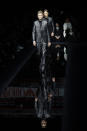 Models wear creations as part of the Emporio Armani men's Fall-Winter 2020/21 collection, that was presented in Milan, Italy, Saturday, Jan. 11, 2019. (AP Photo/Luca Bruno)