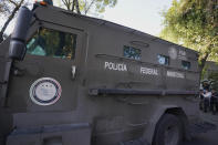 An armored transport drives out of the prosecutor's building where Ovidio Guzmán, one of the sons of former Sinaloa cartel boss Joaquin "El Chapo" Guzmán, is in custody in Mexico City, Thursday, Jan. 5, 2023. The Mexican military has captured Ovidio Guzman during a operation outside Culiacan, a stronghold of the Sinaloa drug cartel in western Mexico. (AP Photo/Fernando Llano)