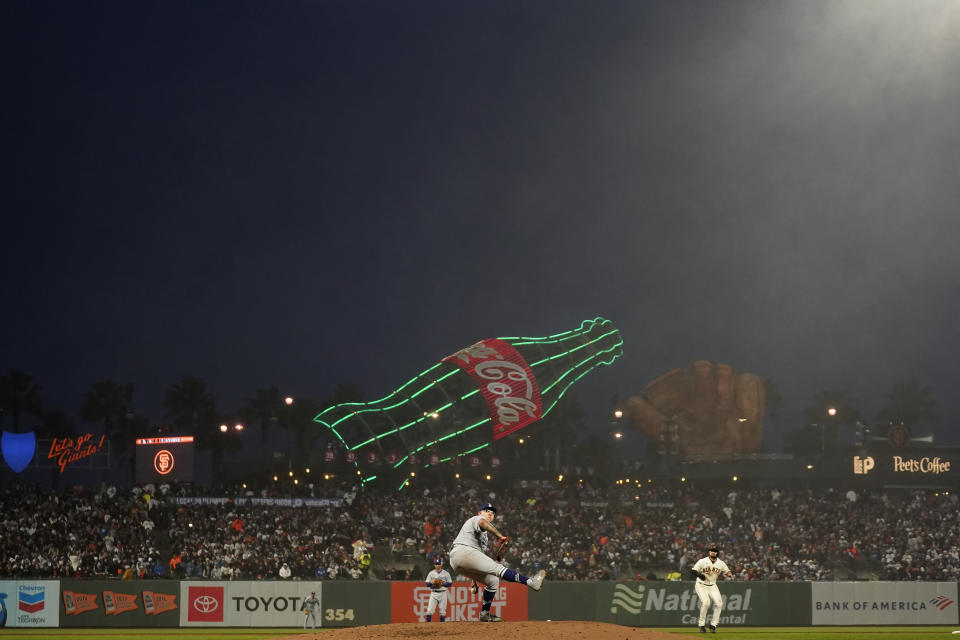 Los Angeles Dodgers pitcher Julio Urias, bottom, works against the San Francisco Giants during the fourth inning of a baseball game in San Francisco, Monday, April 10, 2023. (AP Photo/Jeff Chiu)