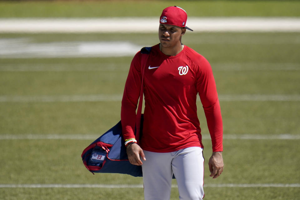 Washington Nationals' Juan Soto walks to the clubhouse at the end of spring training baseball practice Thursday, Feb. 25, 2021, in West Palm Beach, Fla. (AP Photo/Jeff Roberson)