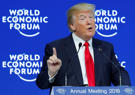 U.S. President Donald Trump gestures as he speaks during the World Economic Forum (WEF) annual meeting in Davos, Switzerland January 26, 2018. REUTERS/Denis Balibouse/Files