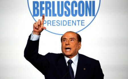 FILE PHOTO: Forza Italia leader Silvio Berlusconi gestures during a meeting in Rome, Italy, March 1, 2018. REUTERS/Alessandro Bianchi