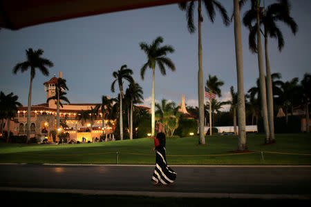 FILE PHOTO - A woman walks as she arrives at Mar-a-Lago estate where U.S. President-elect Donald Trump attends meetings, in Palm Beach, Florida, U.S., December 20, 2016. REUTERS/Carlos Barria/File Photo