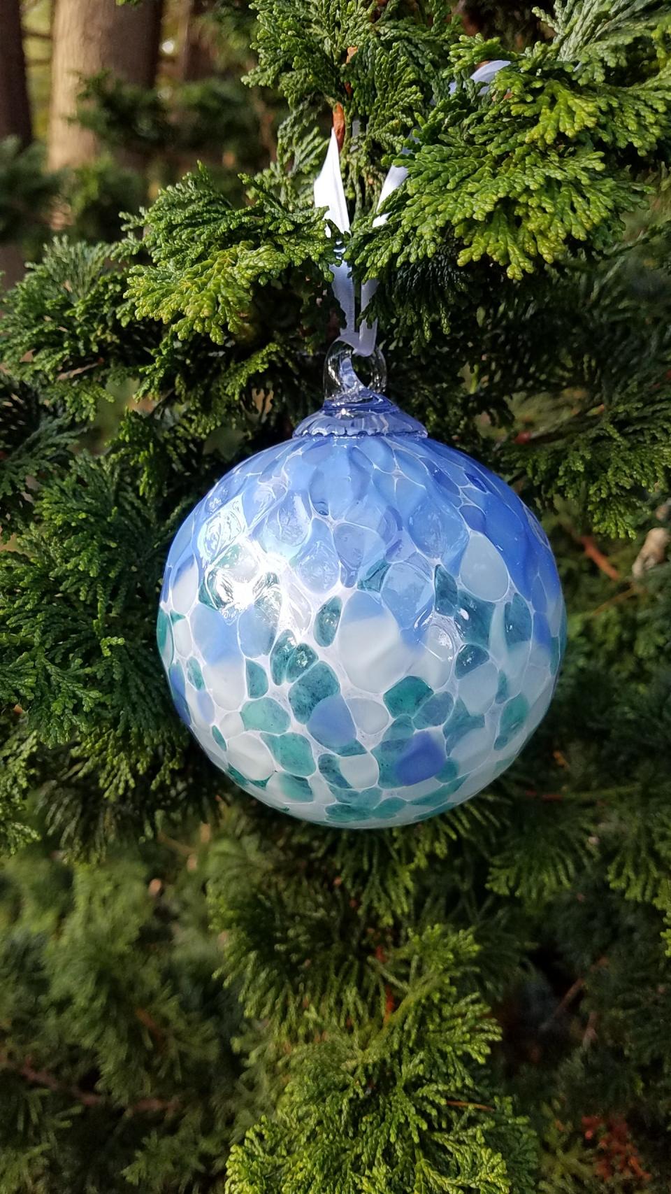 A limited-edition, hand-blown “Froggie” ornament by glass artist Michael Magyar is a special item for sale at the gift shop at Heritage Museums & Gardens in Sandwich.