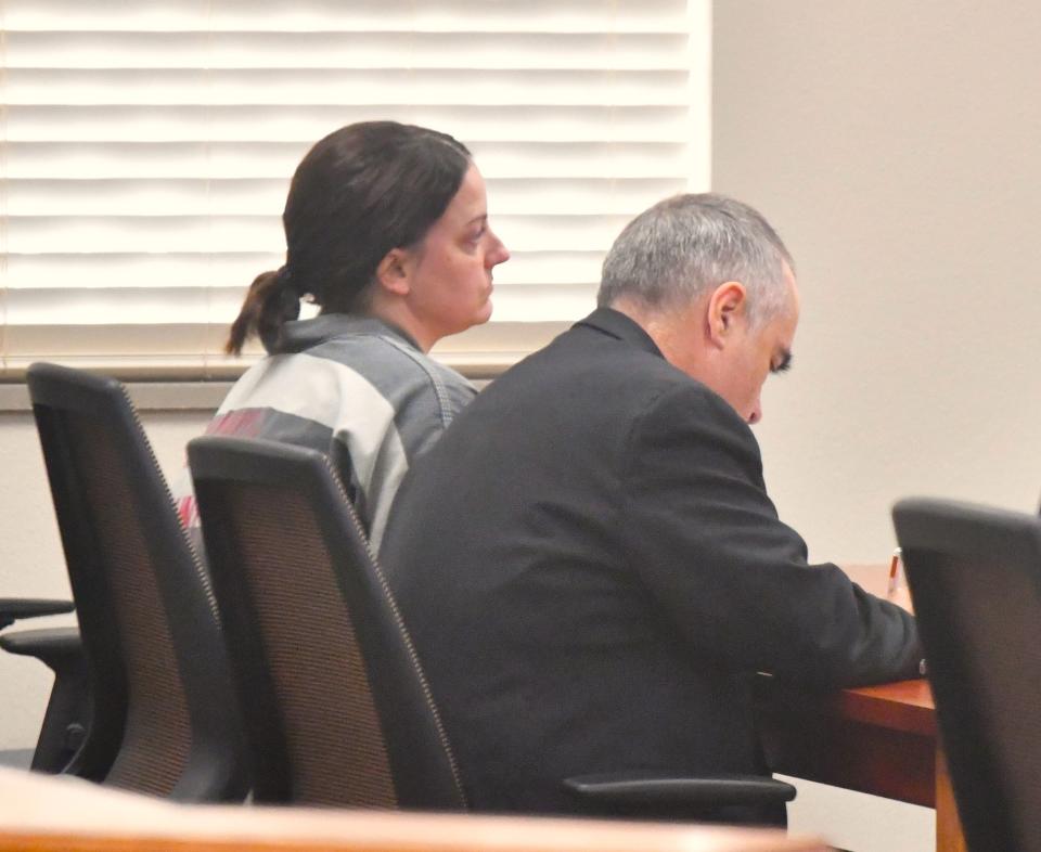 Amber McDaniel (left) sits with Attorney at Law Mark Barber (right) in the 30th District Court at the Wichita County Courthouse on Monday, September 25, 2023.