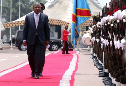 FILE PHOTO: Angolan President Joao Lourenco inspects a guard of honour on a visit to the Democratic Republic of Congo, Feb. 14, 2018. REUTERS/Kenny Katombe/File Photo