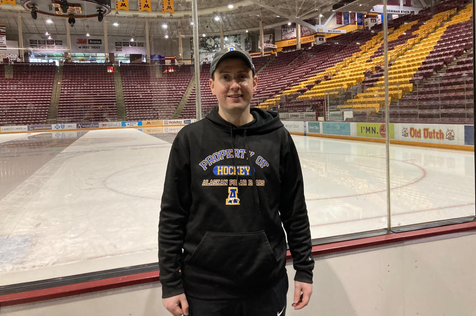 Alaska NCAA college hockey coach Erik Largen poses after practice at Mariucci Arena in Minneapolis, the day before his team played Minnesota, Thursday, Jan. 13, 2022. The Nanooks are all about making the most of what they've got. The latest conference shuffle in the sport left them without league affiliation, so they're currently playing as an independent. Which is so much better than not playing at all, a deprivation they were enduring a year ago due to the pandemic. (AP Photo/Dave Campbell)