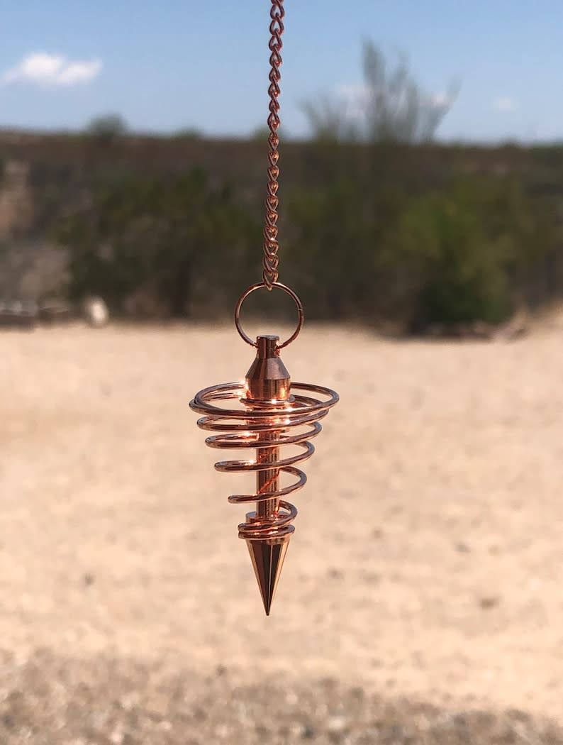 <p><a href="https://go.redirectingat.com?id=74968X1596630&url=https%3A%2F%2Fwww.etsy.com%2Flisting%2F751771881%2Fcopper-spiral-pendulum-copper-vortex&sref=https%3A%2F%2Fwww.cosmopolitan.com%2Fstyle-beauty%2Ffashion%2Fg33928897%2Fgifts-for-witches%2F" rel="nofollow noopener" target="_blank" data-ylk="slk:Shop Now;elm:context_link;itc:0;sec:content-canvas" class="link rapid-noclick-resp">Shop Now</a></p><p>Copper Spiral Pendulum</p><p>$9.00</p><p>etsy.com</p>