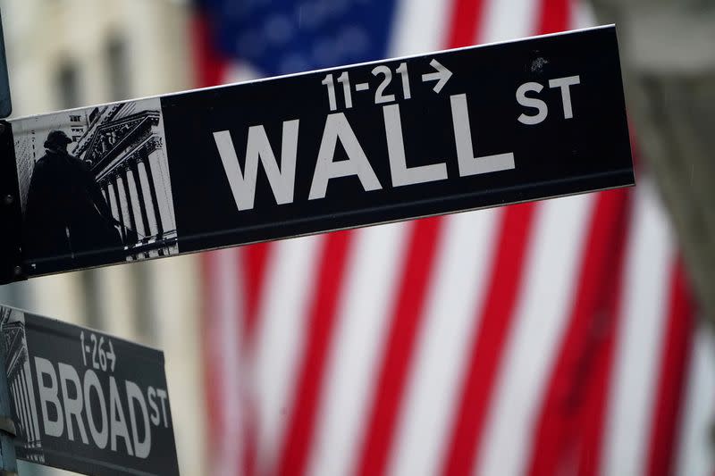 FILE PHOTO: A Wall Street sign is pictured outside the New York Stock Exchange, in New York City