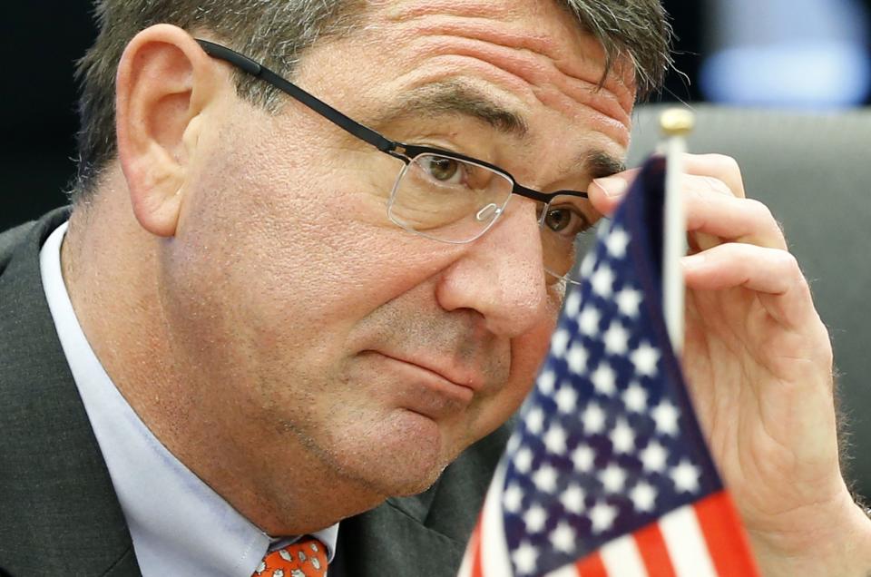 U.S. Deputy Secretary of Defense Ashton Carter adjusts his glasses during his meeting with Japanese Senior Vice Defence Minister Shu Watanabe in Tokyo in this July 20, 2012 file photo. U.S. President Barack Obama is expected to nominate former Pentagon official Carter as U.S. defense secretary, according to media reports. REUTERS/Yuriko Nakao/Files(JAPAN - Tags: POLITICS MILITARY HEADSHOT)