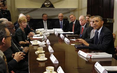 U.S. President Barack Obama meets with health insurance chief executives at the White House in Washington November 15, 2013. REUTERS/Kevin Lamarque