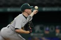 Oakland Athletics starting pitcher JP Sears throws to a Texas Rangers batter during the first inning of a baseball game in Arlington, Texas, Tuesday, Aug. 16, 2022. (AP Photo/Tony Gutierrez)