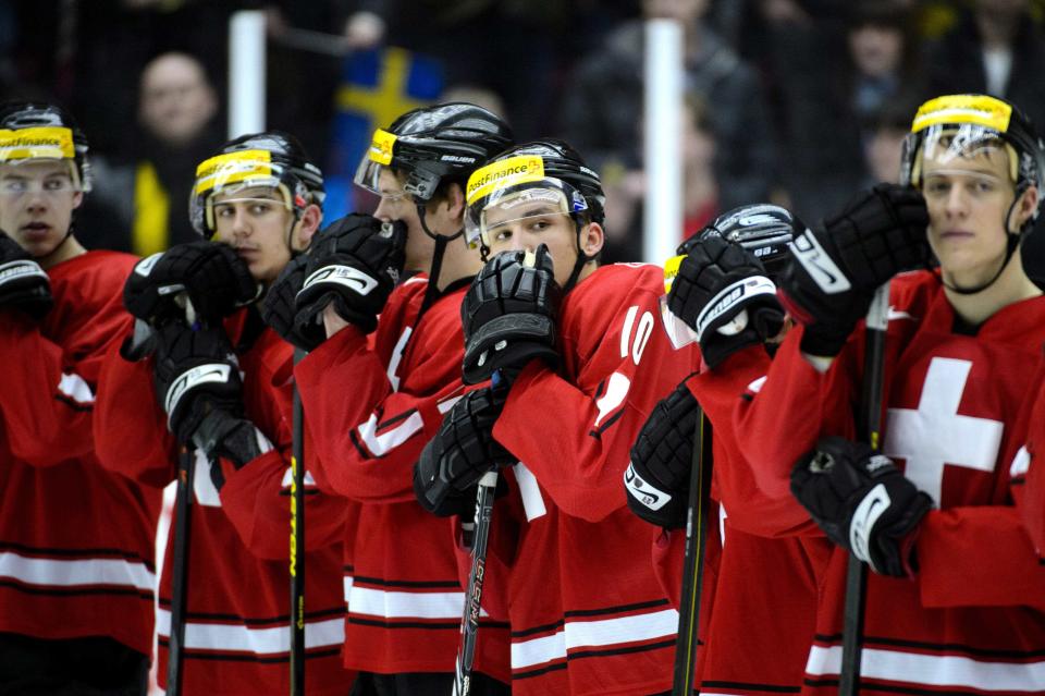 Switzerland's players react after losing their qualification round match against Sweden at the International Ice Hockey Federation (IIHF) World Junior Hockey Championships in Malmo December 26, 2013. REUTERS/Ludvig Thunman/TT News Agency (SWEDEN - Tags: SPORT ICE HOCKEY) ATTENTION EDITORS � THIS IMAGE WAS PROVIDED BY A THIRD PARTY. FOR EDITORIAL USE ONLY. NOT FOR SALE FOR MARKETING OR ADVERTISING CAMPAIGNS. SWEDEN OUT. NO COMMERCIAL OR EDITORIAL SALES IN SWEDEN. THIS PICTURE IS DISTRIBUTED EXACTLY AS RECEIVED BY REUTERS, AS A SERVICE TO CLIENTS