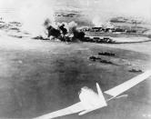 <p>A Japanese bomber aircraft is seen in the foreground of an aerial photograph taken by a Japanese pilot during the attack on Pearl Harbor on Dec. 7, 1941. (U.S. Navy/NEA Services/Handout via Reuters) </p>