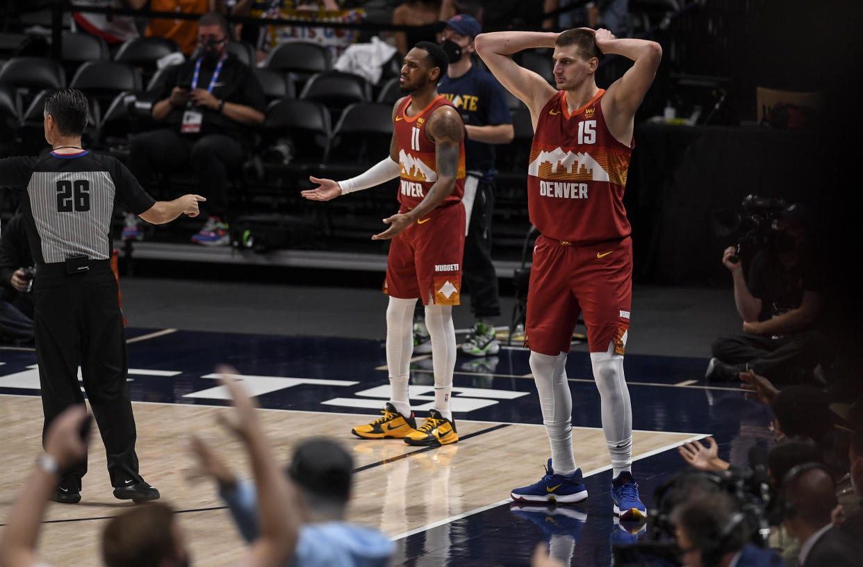 DENVER, CO - JUNE 13: Nikola Jokic (15) and Monte Morris (11) of the Denver Nuggets react to a call for a jump ball by referee Pat Fraher (26) during the second quarter against the Phoenix Suns at Ball Arena on Sunday, June 13, 2021. The Denver Nuggets hosted the Phoenix Suns for game four of their best-of-seven NBA Playoffs series. (Photo by AAron Ontiveroz/MediaNews Group/The Denver Post via Getty Images)