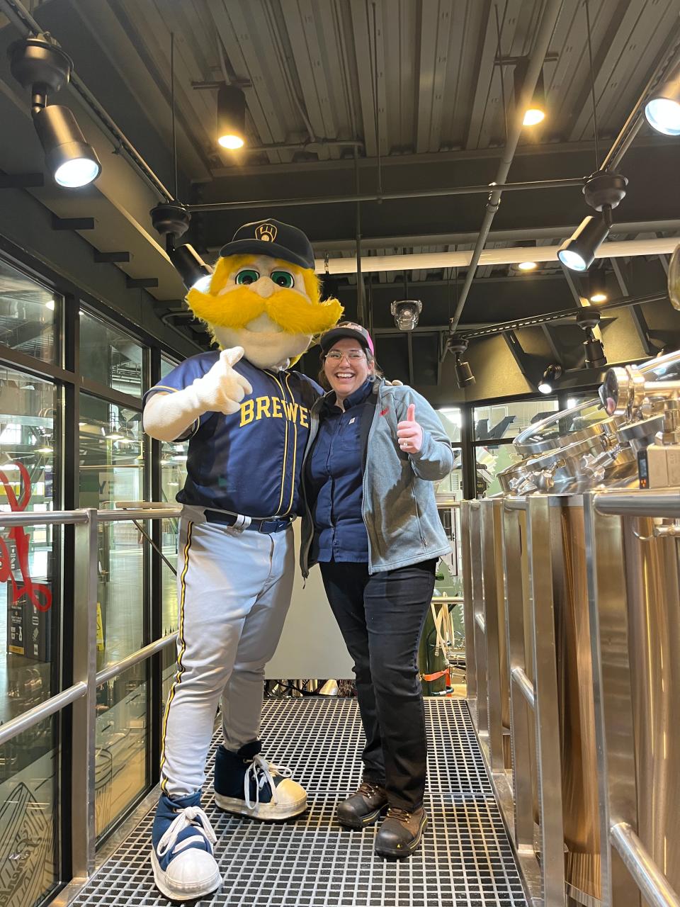 Corrine Georges poses with Bernie Brewer in J. Leinenkugel's Barrel Yard at American Family Field. Georges is the pilot brewery's first and only brewer on-site.