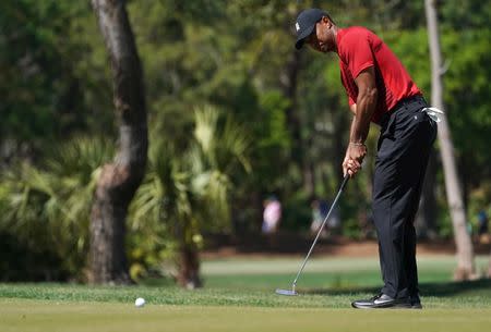 Mar 11, 2018; Palm Harbor, FL, USA; Tiger Woods putts on the 3rd during the final round of the Valspar Championship golf tournament at Innisbrook Resort - Copperhead Course. Jasen Vinlove-USA TODAY Sports