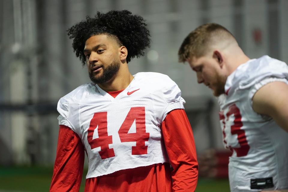 Mar 7, 2024; Columbus, OH, USA; Ohio State Buckeyes defensive end JT Tuimoloau (44) talks to defensive end Jack Sawyer (33) during spring football practice at the Woody Hayes Athletic Center.