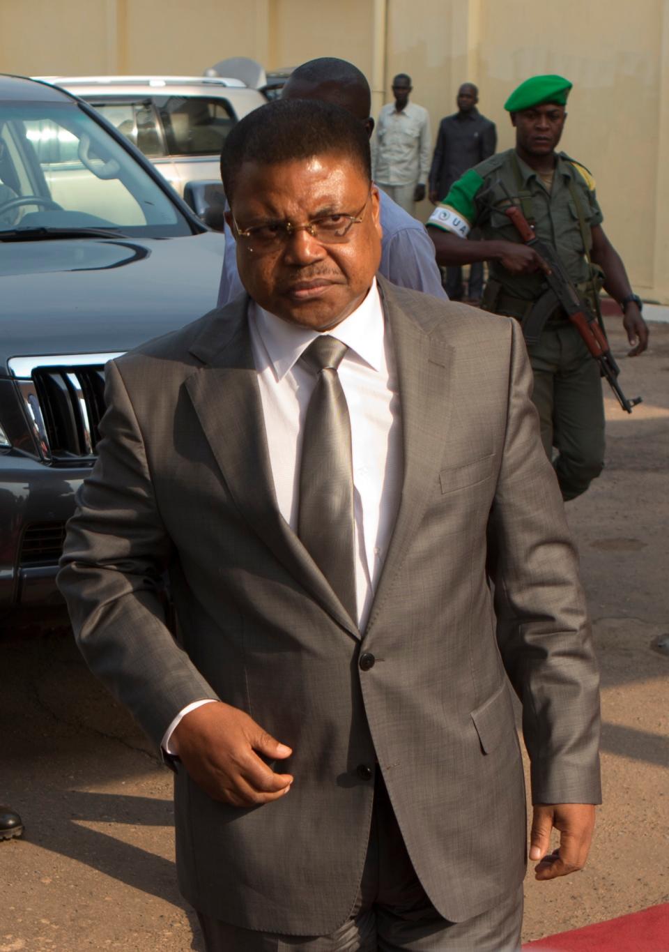 FILE - This is a Wednesday, Jan. 8, 2014 file photo of Central African Republic Prime Minister Nicolas Tiangaye as he arrives at Mpoko Airport, in Bangui, Central African Republic. Central African Republic Michel Djotodia, agreed to resign Friday Jan. 10, 2014 along with his Prime Minister Nicolas Tiangaye regional officials announced. The move comes following growing pressure for Djotodia to step aside and should help placate the armed militias who have used to violence to seek his ouster. However, his departure could also create an even greater power vacuum in a land that has long known coups and dictatorship. (AP Photo/Rebecca Blackwell, File)