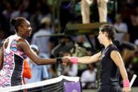 Mar 31, 2015; Key Biscayne, FL, USA; Carla Suarez Navarro (right) shakes hands with Venus Williams (left) on day nine of the Miami Open at Crandon Park Tennis Center. Navarro won 0-6, 6-1, 7-5. Mandatory Credit: Geoff Burke-USA TODAY Sports