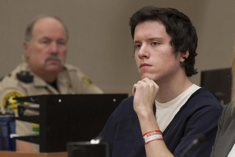 FILE - Defendant John Earnest listens during testimony by witness Oscar Stewart during Earnest's preliminary hearing, Thursday, Sept. 19, 2019, in Superior Court in San Diego. Earnest has been sentenced on Tuesday, Dec. 28, 2021, to life in federal prison for killing a woman and injuring three others when he burst into a Southern California synagogue in 2019, adding to a life sentence he received three months earlier in state court. (John Gibbins/The San Diego Union-Tribune via AP, Pool, File)