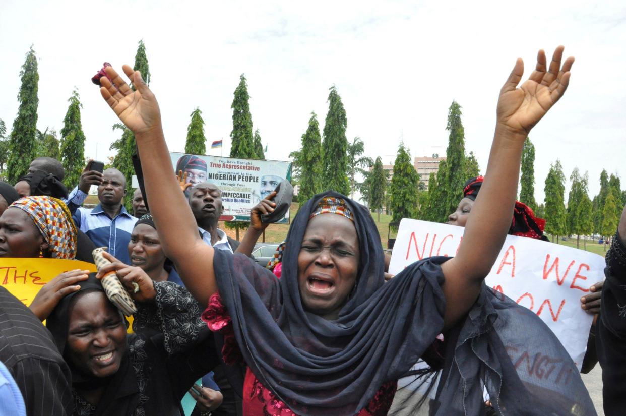 An unidentified mother cries out during a demonstration with others who have daughters among the kidnapped school girls of government secondary school Chibok