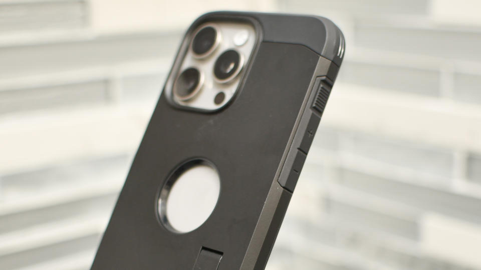 iPhone 15 Pro Max in a case, showing the action button from the side