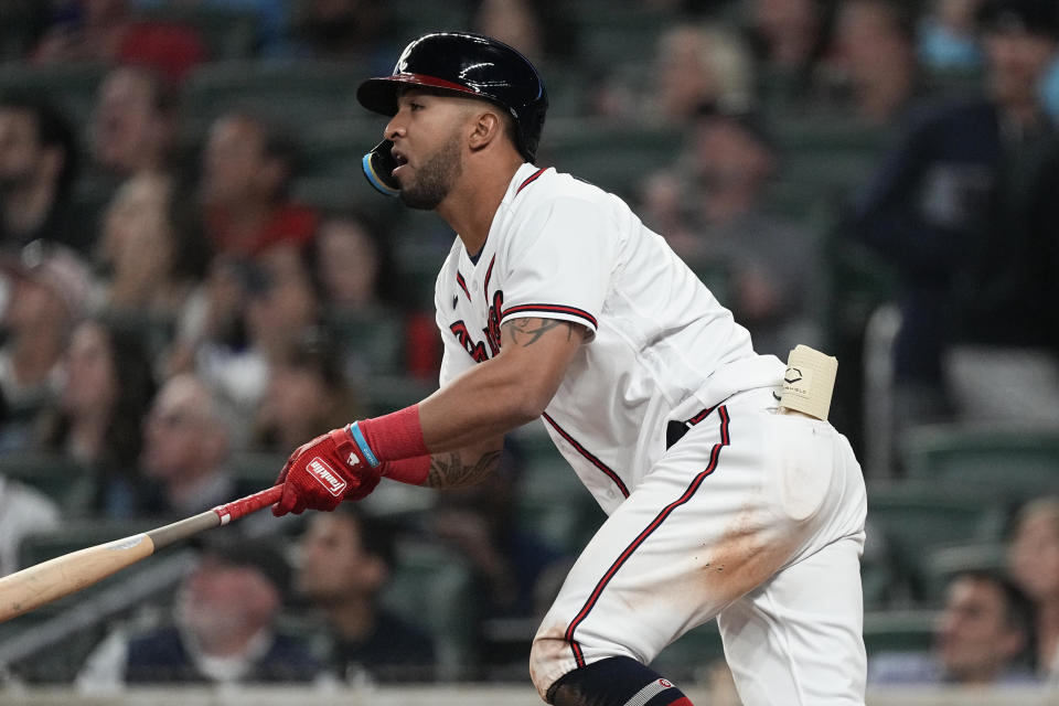 Atlanta Braves' Eddie Rosario watches his solo home run against the Cincinnati Reds during the eighth inning of a baseball game Wednesday, April 12, 2023, in Atlanta. (AP Photo/John Bazemore)