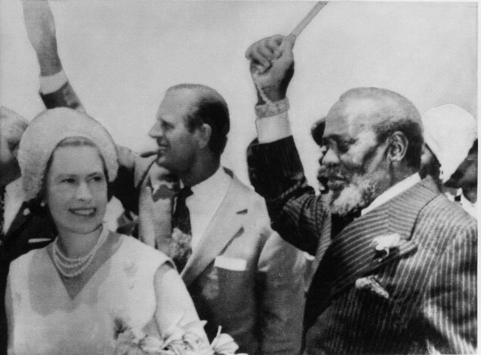 Britain's Queen Elizabeth II, Prince Philip and Kenya's President Jomo Kenyatta, right, wave to the crowd in Nairobi ,Kenya, March 26, 1972. Kenyatta welcomed the royal couple to Nairobi, the last stop on the Queen's tour before returning to Britain. Prince Philip is to remain in the African nation for another week. ( AP Photo/ Peter Winterbach )