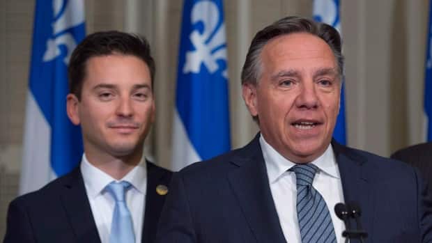 Quebec Justice Minister Simon Jolin-Barrette, left, and Premier François Legault shown two years ago. The provincial government intends to appeal Tuesday's Quebec Superior Court decision on Bill 21, unhappy with the exemptions granted.