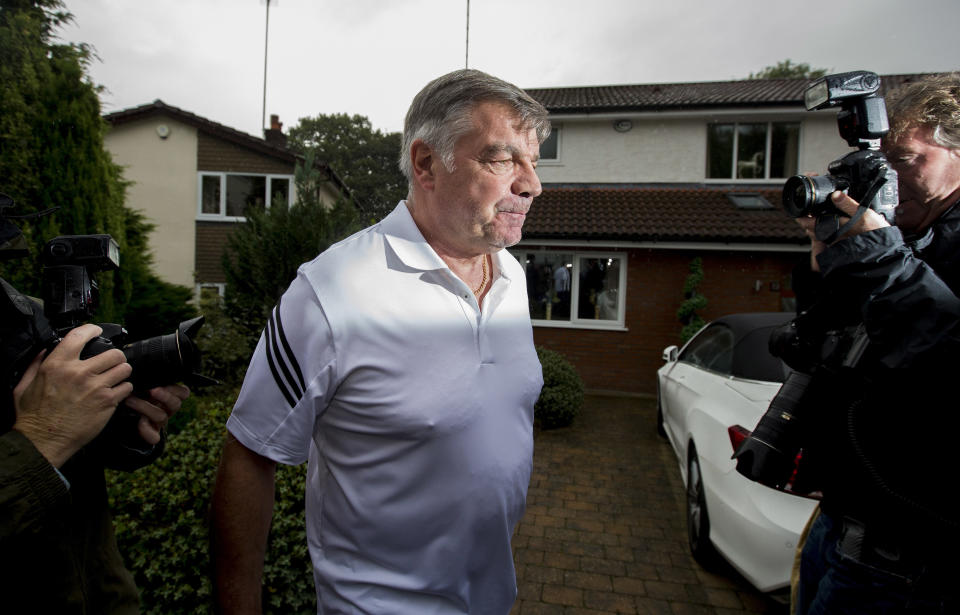 Sam Allardyce is swarmed by reporters as he leaves his family home in Bolton following his resignation as England manager. (Getty)