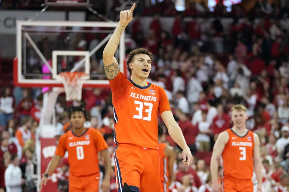 March 2, 2024;  Madison, Wisconsin, USA;  Illinois Fighting Illini forward Coleman Hawkins (33) celebrates the Illinois Fighting Illini's 91-83 victory over the Wisconsin Badgers at the Kohl Center.  Mandatory Credit: Kayla Wolf-USA TODAY Sports