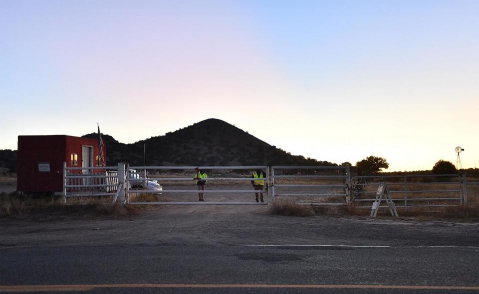 PHOTO: Security guards stand behind a locked gate at the entrance to the Bonanza Creek Ranch, Oct. 22, 2021, in Santa Fe, N.M.  (Sam Wasson/Getty Images)