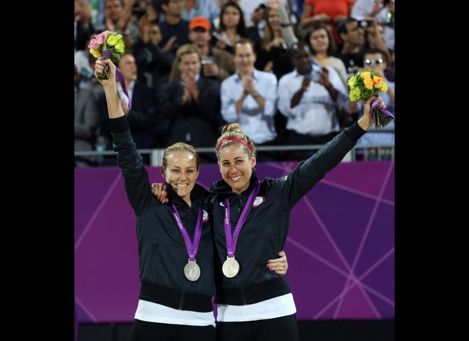 The United States' Jennifer Kessy, left, and April Ross celebrate with their Silver medals during the women's beach volleyball medal ceremonies at the 2012 Summer Olympics, Wednesday, Aug. 8, 2012, in London. 