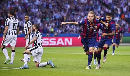 Ivan Rakitic celebrates with Neymar after scoring the first goal for Barcelona. Reuters / Dylan Martinez