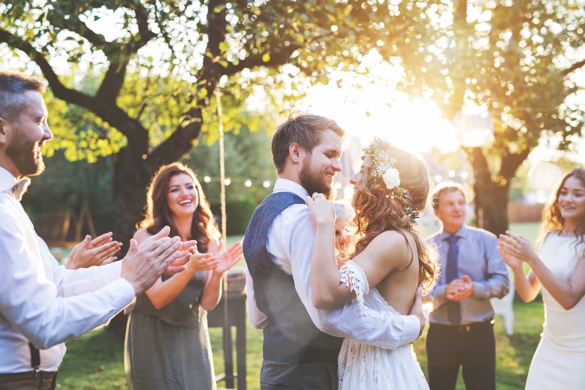 Bride and groom dancing at wedding  (Getty Images/iStockphoto)