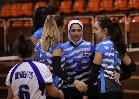 Iranian volleyball player Zeinab Giveh (C) celebrates a point with her teammates during a training session of "Shumen" volleyball club in the city of Shumen, Bulgaria January 14, 2017. Picture taken on January 14, 2017. REUTERS/Stoyan Nenov